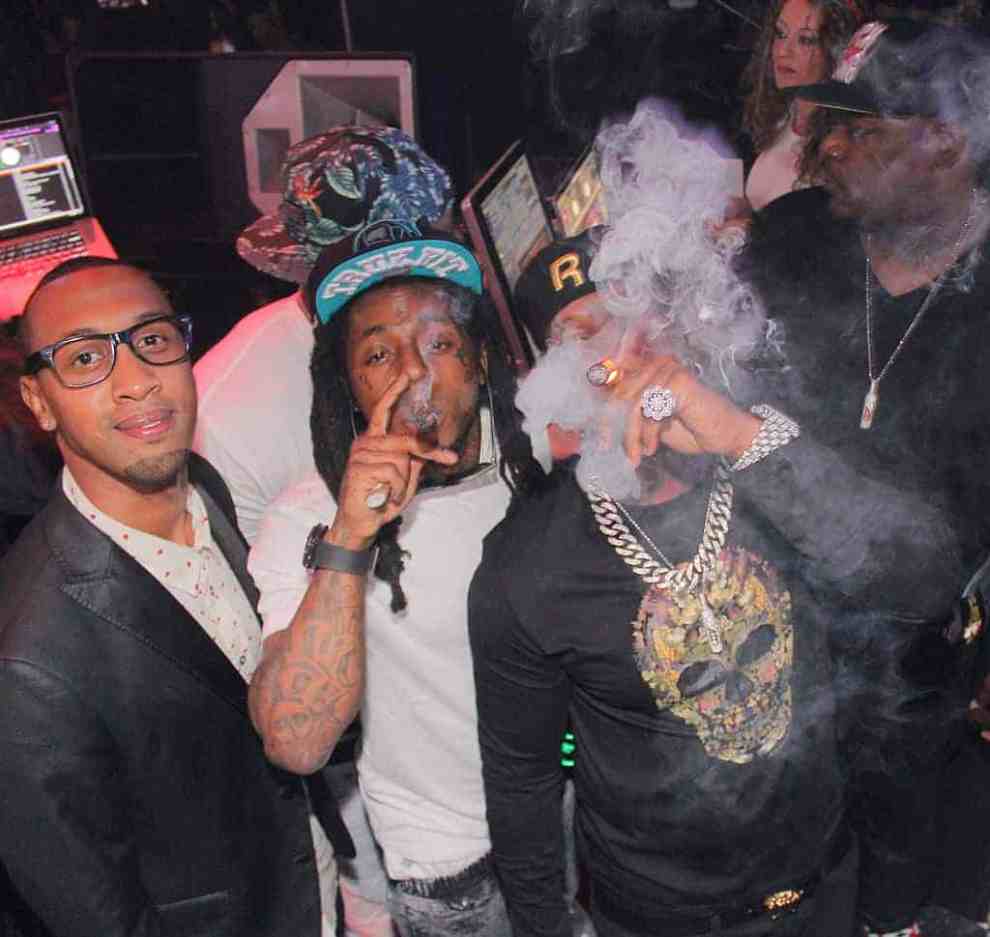 Birdman with Lil Wayne smoking cigars