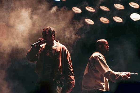 Kanye west and Travis Scott performing on stage