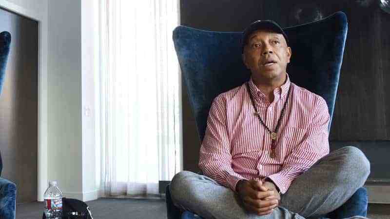 Entrepreneur Russell Simmons enters the "AOL Build" taping at the AOL Studios on July 17