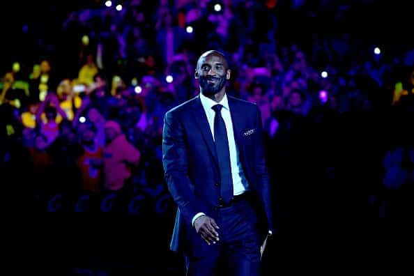 Kobe Bryant smiles at halftime as both his #8 and #24 Los Angeles Lakers jerseys are retired at Staples Center on December 18