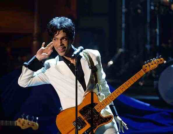 Prince performs after being inducted into the Rock and Roll Hall of Fame