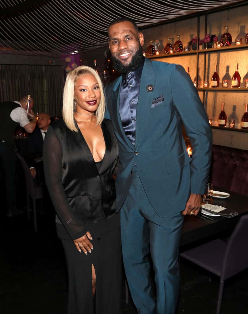 LeBron and Savannah James wearing Green and Black