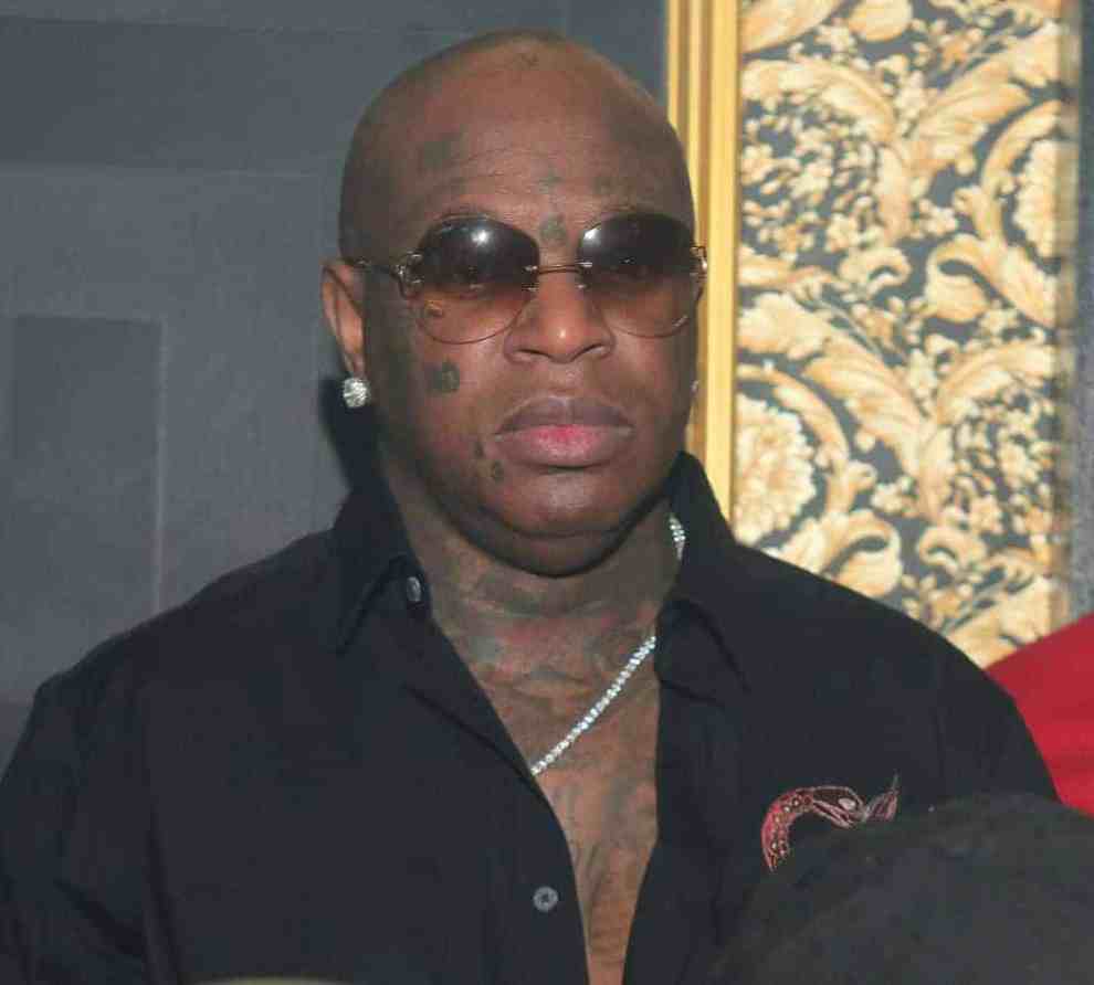 Birdman wearing all black and sunglasses