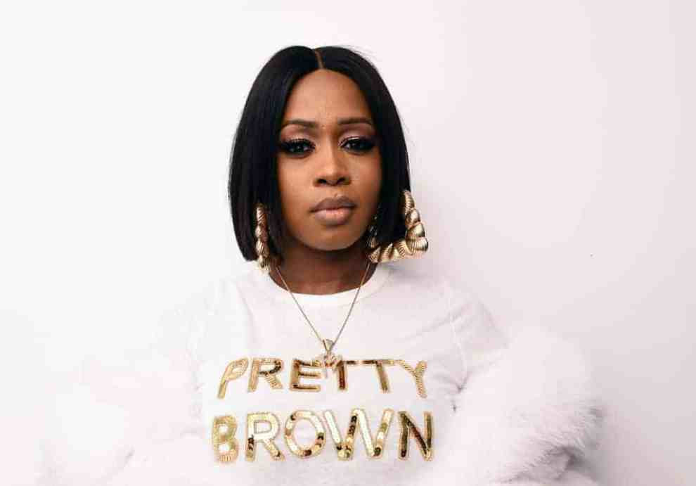 Remy Ma wearing shirt reading "Pretty Brown"