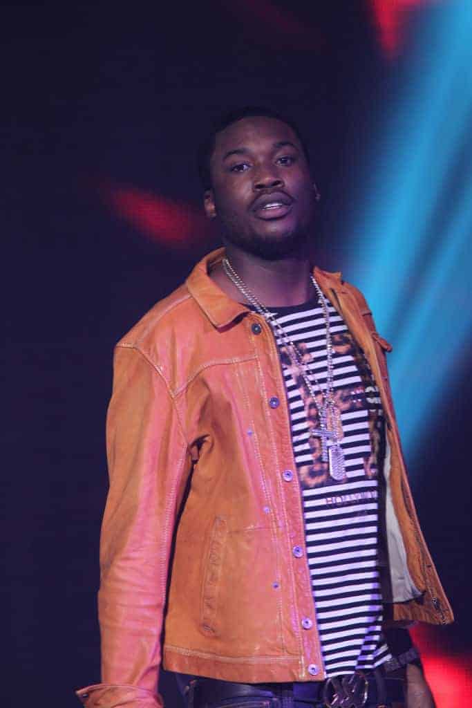 Meek Mill wearing orange and black