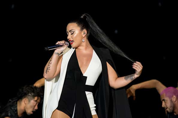 Demi Lovato performing on stage.