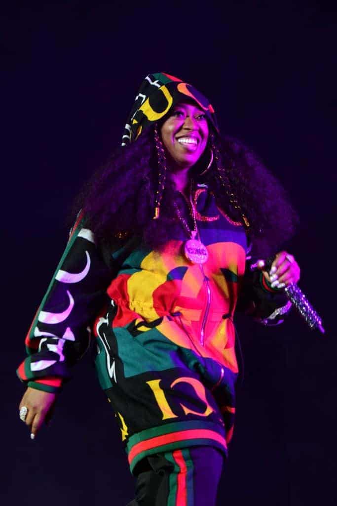 Missy Elliott wearing a hoodie on stage