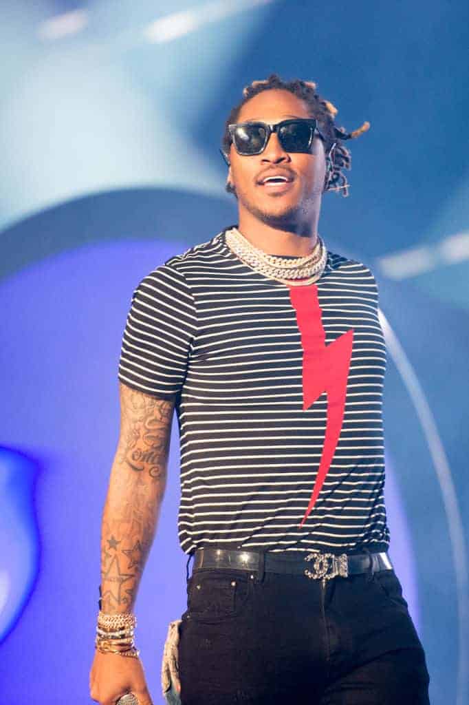 Future on stage wearing a black and white stripe shirt with a red thunder bolt.