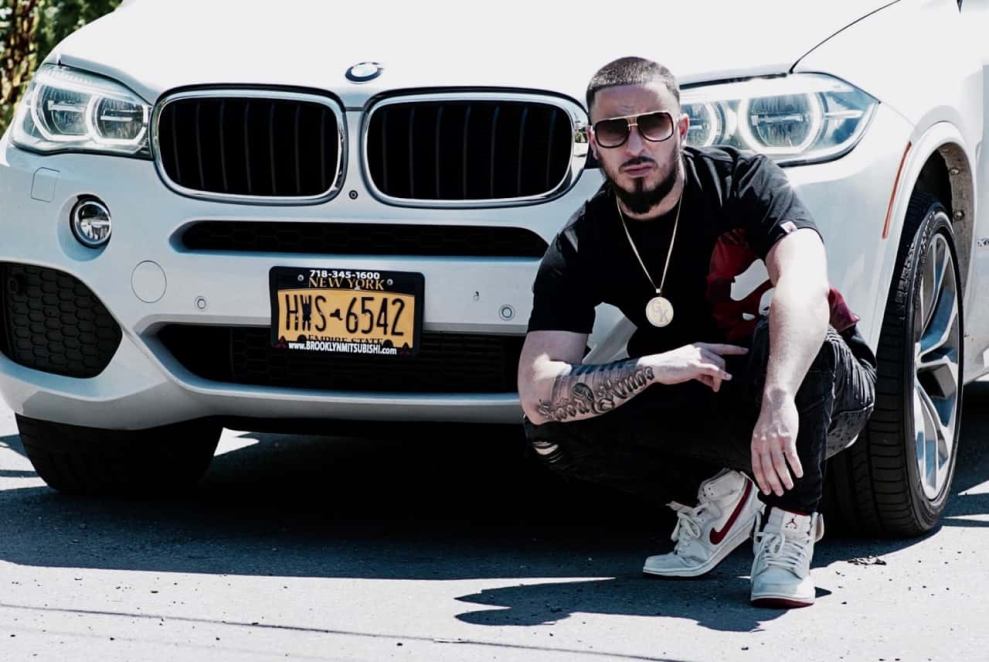 Stumbles in front of white BMW