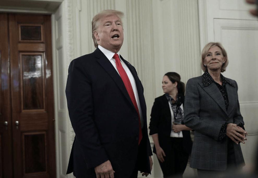 U.S. President Donald Trump speaks to members of the media after greeting athletes during a NCAA National Champion Day event at