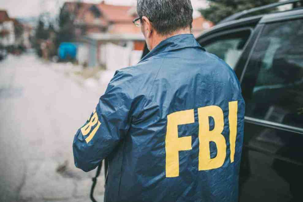 an FBI agent and a car