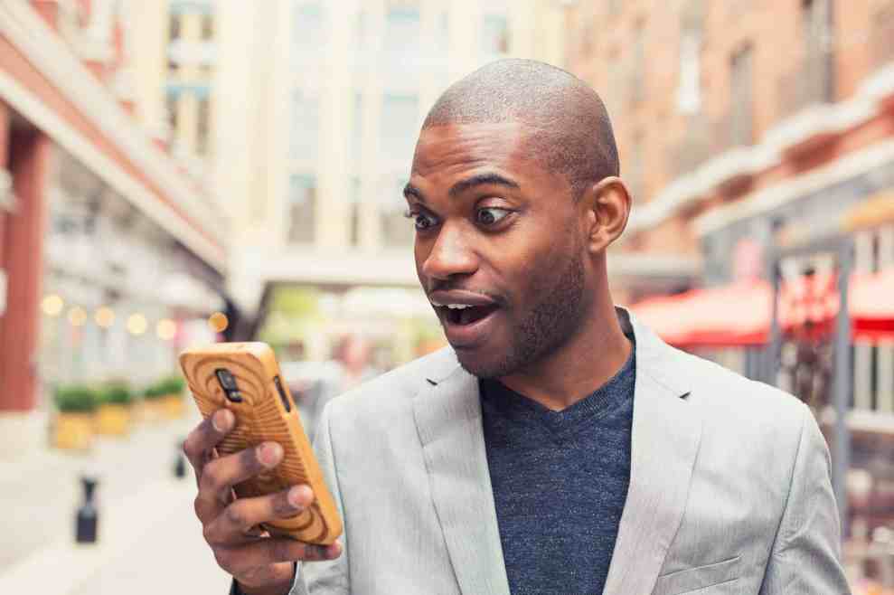 a man looking at his cell phone