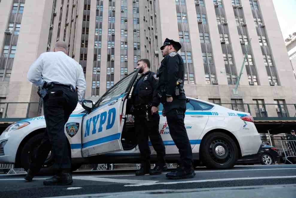 NYPD officers gather outside of Manhattan Criminal Courthouse on April 03, 2023 in New York City. Former President Donald Trump is scheduled to travel to New York City today with an expected arraignment tomorrow at a Manhattan courthouse following his indictment by a grand jury. The indictment is sealed but a grand jury has heard evidence related to money paid to adult film actress Stormy Daniels during Trump’s 2016 presidential campaign.