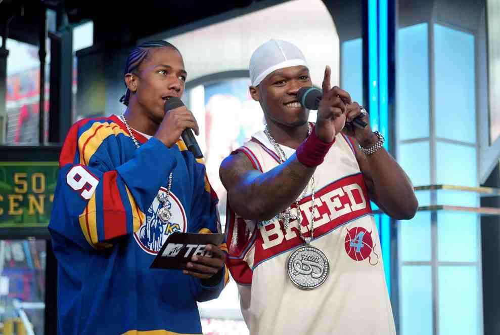 NEW YORK - APRIL 14: (U.S. TABS OUT) Rapper 50 Cent (R) and VJ Nick Cannon kick off "TRL High School Week" on MTV at the MTV Times Square Studios April 14, 2003 in New York City.