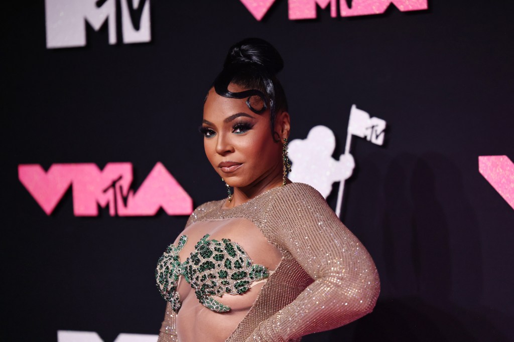 Ashanti Stuns In The Tropics – Rocks A Jaw Dropping Pink Bikini 