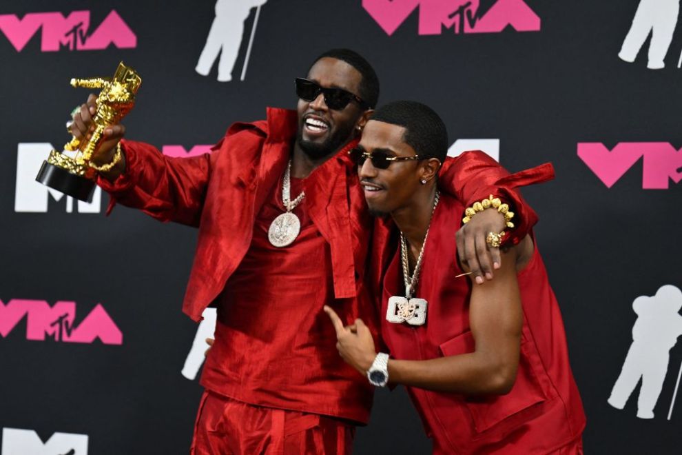 US producer-musician Sean "Diddy" Combs (L) and his son US rapper King Combs pose with the Global Icon award in the press room during the MTV Video Music Awards at the Prudential Center in Newark, New Jersey, on September 12, 2023. (Photo by ANGELA WEISS / AFP)