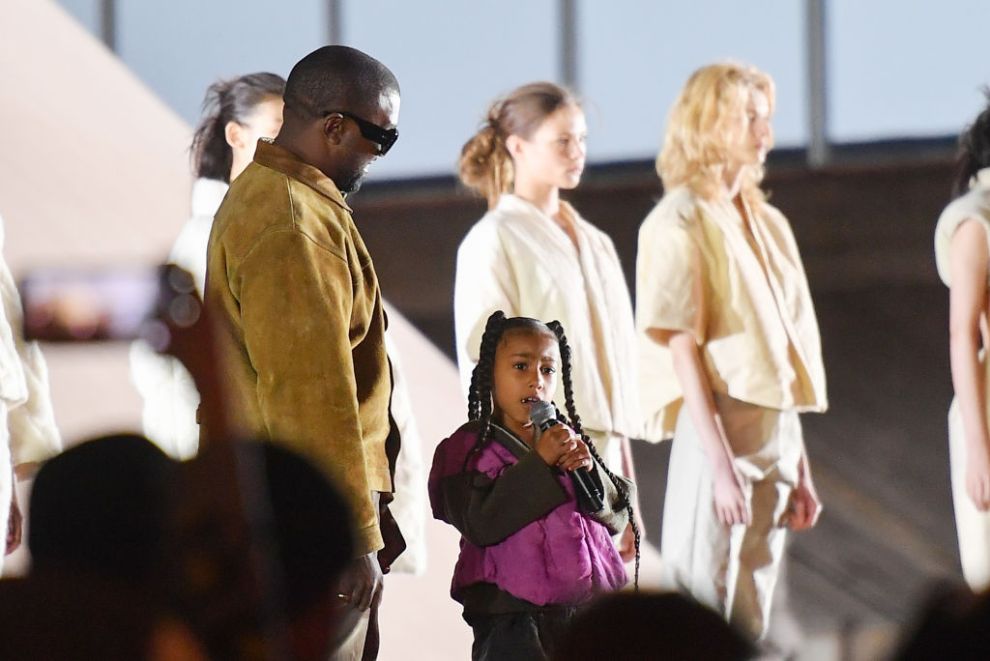 PARIS, FRANCE - MARCH 02: Kanye West and her daughter North West who sings on the runway during the "Yeezy Season 8" show as part of the Paris Fashion Week Womenswear Fall/Winter 2020/2021 on March 02, 2020 in Paris, France.