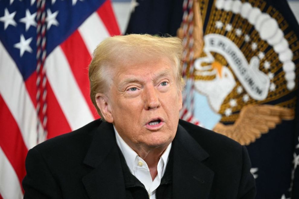 US President Donald Trump speaks at a Hurricane Helene recovery briefing in a hangar at the Asheville Regional Airport in Fletcher, North Carolina, on January 24, 2025. Trump said he may "get rid of FEMA," if deemed necessary. The Federal Emergency Management Agency (FEMA) is tasked coordinating the response to a disaster.