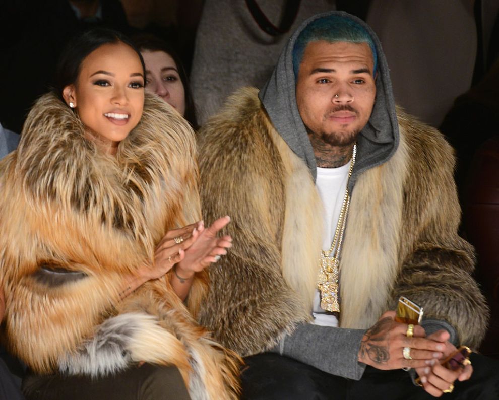 Karrueche Tran (L) and Chris Brown attends the Michael Costello fashion show during Mercedes-Benz Fashion Week Fall 2015 at The Salon at Lincoln Center on February 17, 2015 in New York City.