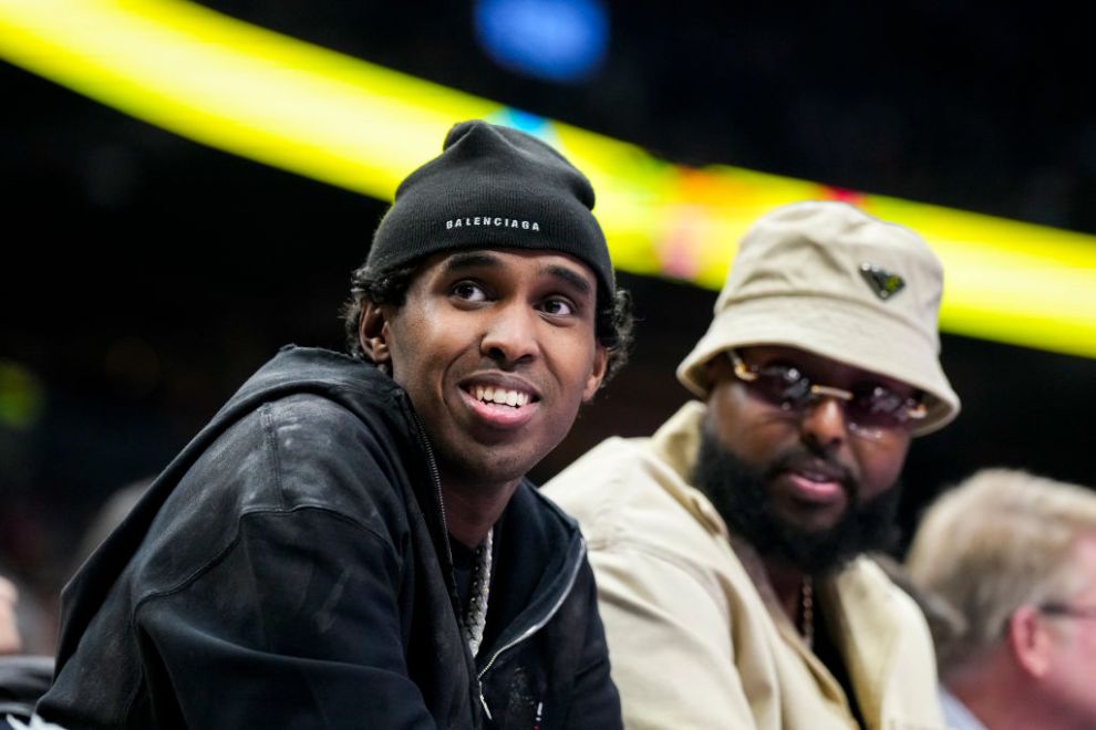 TORONTO, ON - DECEMBER 3: Local rapper Top5 looks on from the courtside at a NBA between the Indiana Pacers and Toronto Raptors during the Emirates NBA Cup game at the Scotiabank Arena on December 3, 2024 in Toronto, Ontario, Canada.