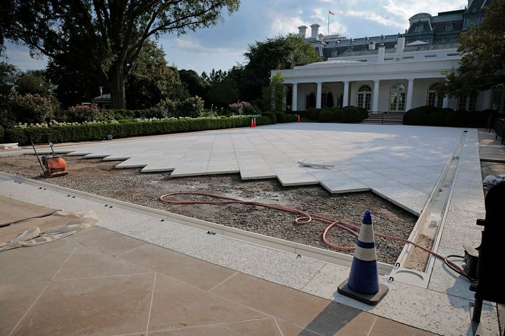 WASHINGTON, DC - JULY 23: Work continues in paving over the White House Rose Garden lawn on July 23, 2025 in Washington, DC. Trump today signed executive orders related to his AI "Action Plan" intended to promote U.S. dominance of the technology.