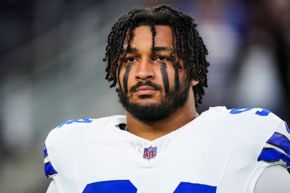 Marshawn Kneeland #94 of the Dallas Cowboys looks on from the sideline during the national anthem prior to an NFL football game against the Tampa Bay Buccaneers at AT&T Stadium on December 22, 2024 in Arlington, Texas.