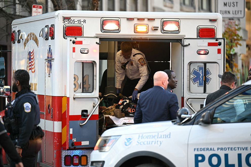 An unidentified man in military fatigues lies on a stretcher inside an ambulance 26 November, 2025 in downtown Washington, DC. Two National Guard soldiers were shot a few blocks from the White House, according to law enforcement.